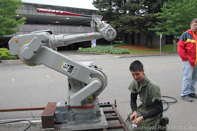 Liam McNamara works on the Motoman