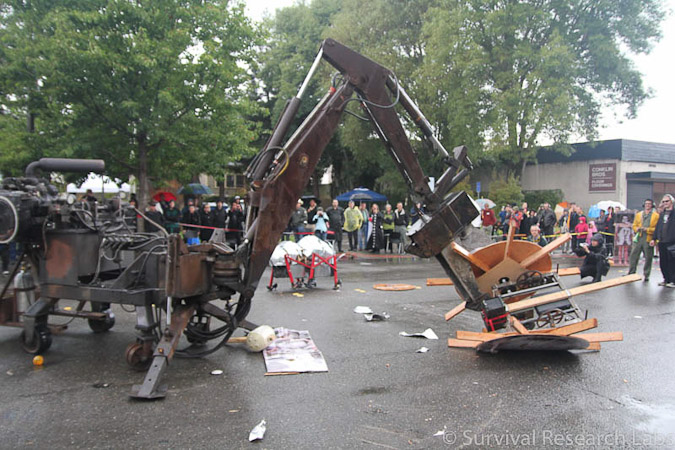 Big Arm vs Stick Wheel Robot