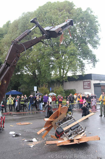 Big Arm vs Stick Wheel Robot