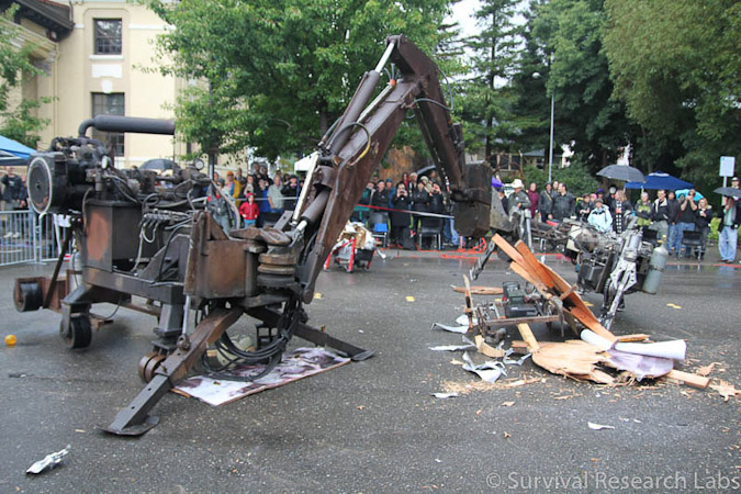 Big Arm vs Stick Wheel Robot