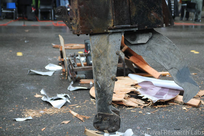 Big Arm vs Stick Wheel Robot