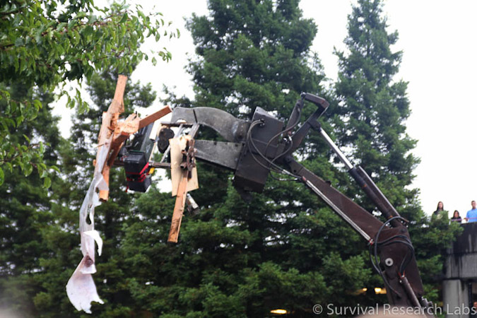 Big Arm munches on the Stick Wheel Robot