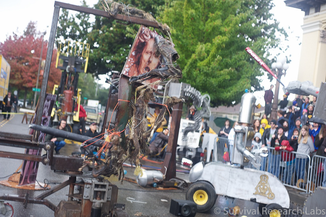 Motoman swings a bat at the Coyote Ugly Man