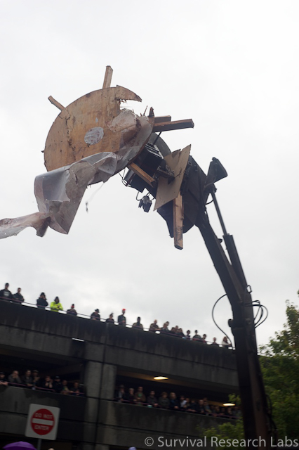 Big Arm crunching the Stick Wheel Robot